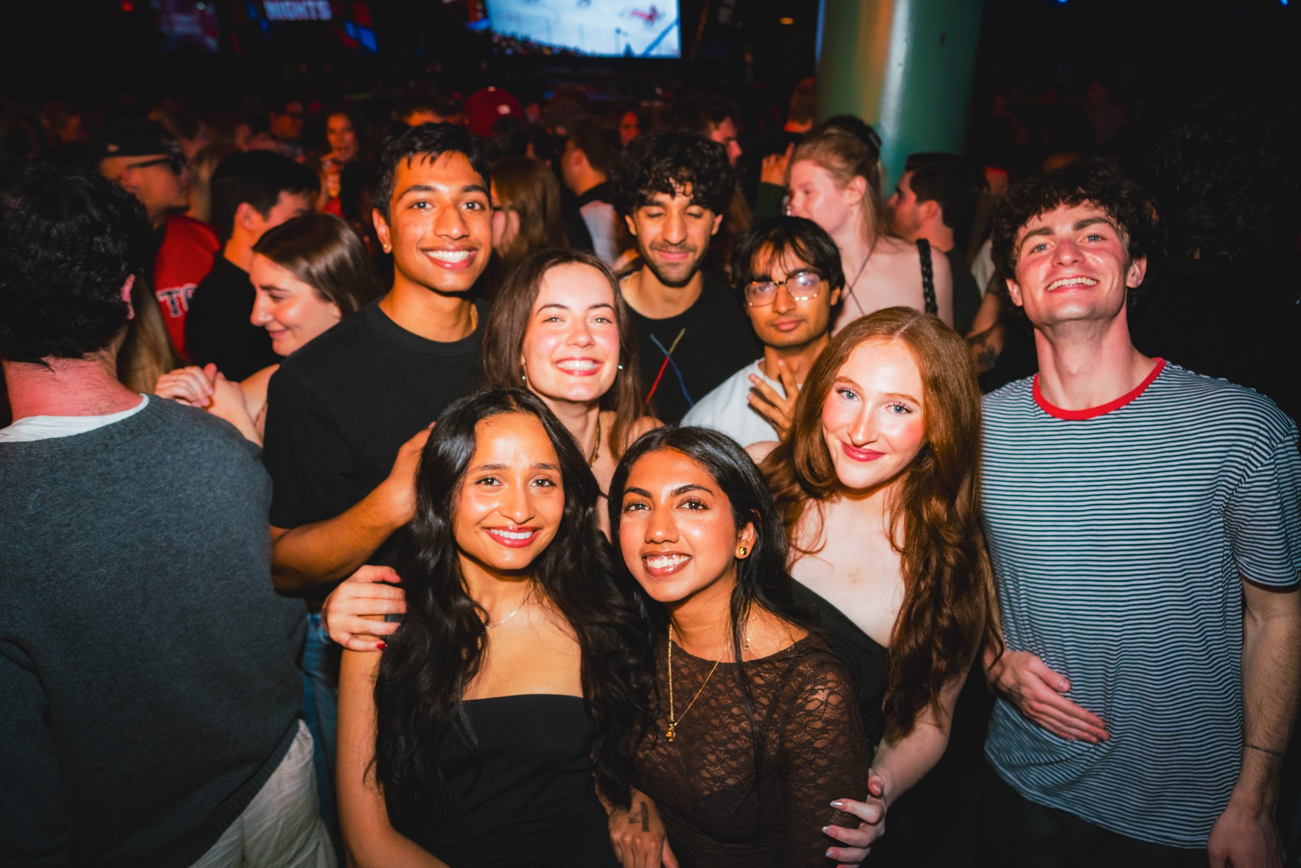 Group of friends celebrating together at Game On